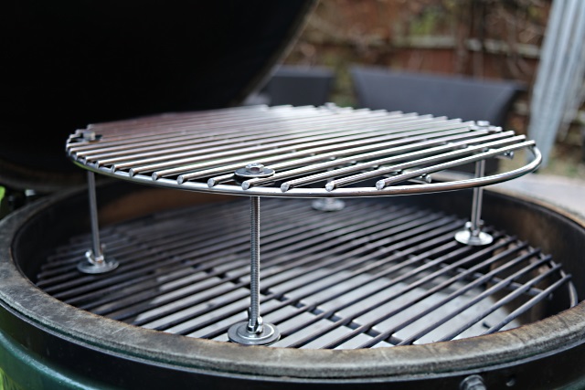 An adjustable height raised cooking surface for a Large Egg