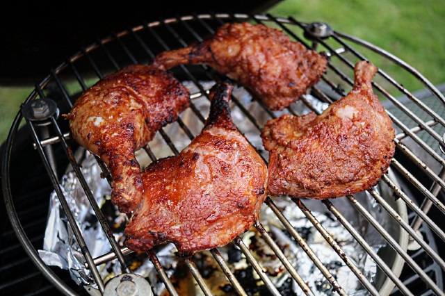 Smoking and roasting duck legs in Big Green Egg on raised grid