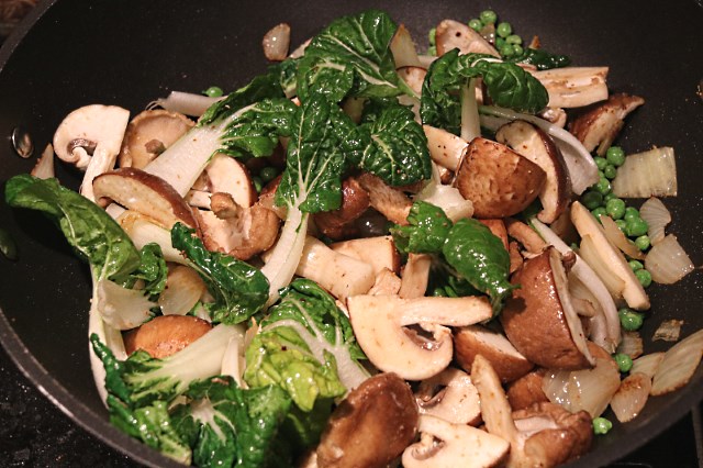 Vegetables stir frying in a wok