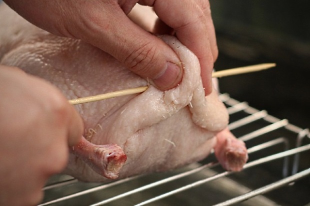 Sealing the duck with a wooden skewer